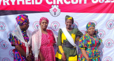 An image of four ladies from Mondlo Methodist Church wearing their traditional African attires at the Pentecost and Africa Day celebration.