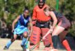 Image of girls' hockey players from Sarel Cilliers and Dundee High battling for the ball.