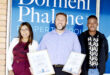 Image of Dormehl Phalane estate agents standing outside the Dundee office with certificates.