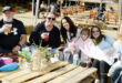 Image of people sitting in close promixity around a table at the Dundee Junior geefees