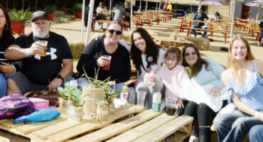 Image of people sitting in close promixity around a table at the Dundee Junior geefees