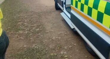Image of EMRS vehicle outside a primary school to treat ill children.