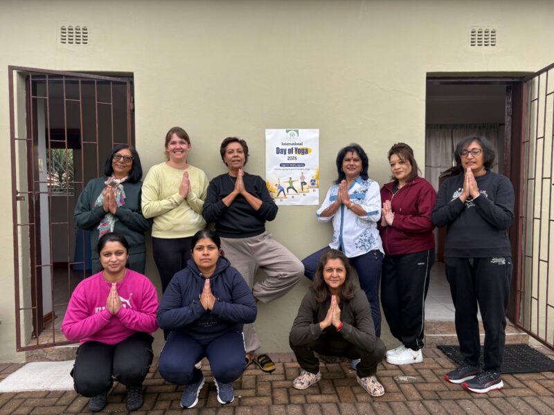 A large photo of a group of women doing a yoga pose.