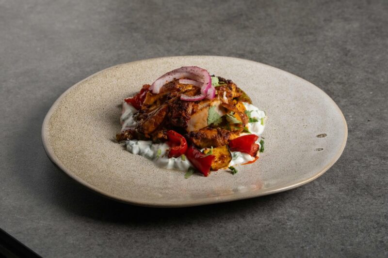 A plate of food on a kitchen table.