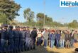 Image of police and other law enforcement agencies gathered before a convoy.