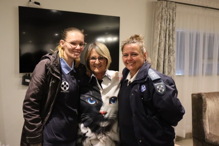 A group photo of three womaen working at the Newcastle SPCA.