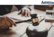 An image of a judges gavel in a courtroom.