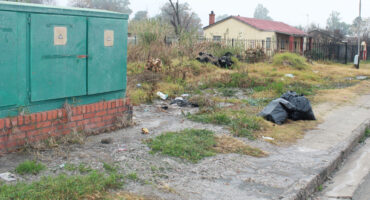 Image of effluent leaking on to a pavement near a sub unit.