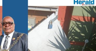 Image of open electrical boxes and Mayor Mkhwanazi.