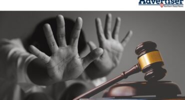 A black and white photo of a women with her hands forward. Inset is a gavel.