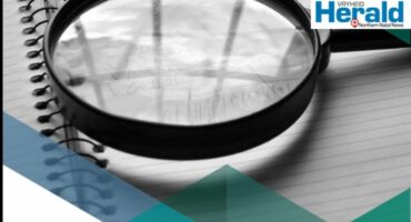 Image of a report under a magnifying glass.