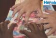 Image of hands grabbing money.
