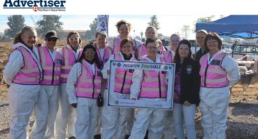 A photo of the Newcastle Lions Club ladies taken outside in an open field.