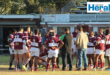 Image of Vryheid's rugby players gathering in a circle with coaches.