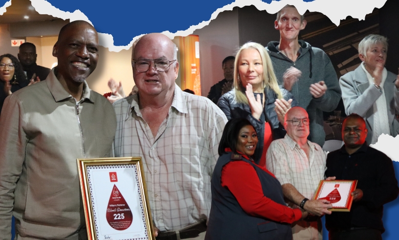225th Milestone donor, Willem Pieterse posing with several other people, and people clapping pictured in the background.