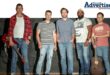 A group photo of a male orientated band posing in front of a black wall. Top corner is the Newcastle Advertiser logo.