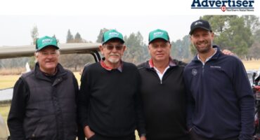 A group photo of four male golfers in Newcastle.