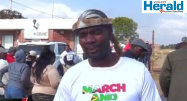 An image of Mduduzi Buthelezi outside the Hlobane Court as they show support to the three members of March and March organisation after their arrest.