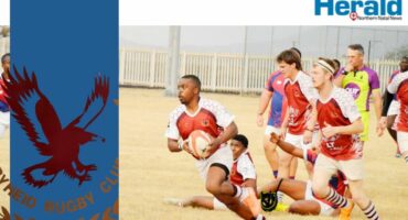 Image of Vryheid rugby player with ball in hand, running.