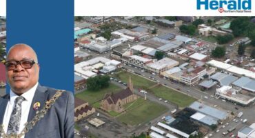 Image of an aerial photo of Vryheid with Mayor Mkhwanazi as inset.