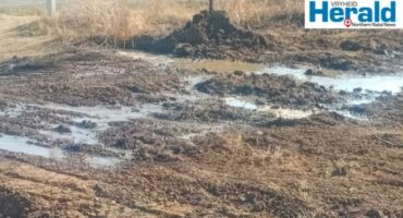 Image of water leaking through gravel.