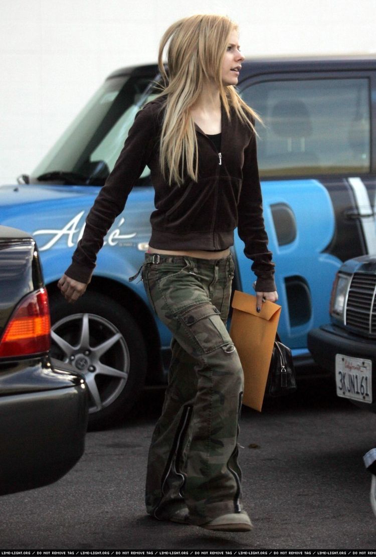 A celebrity is photographed walking down the street in cargo pants.