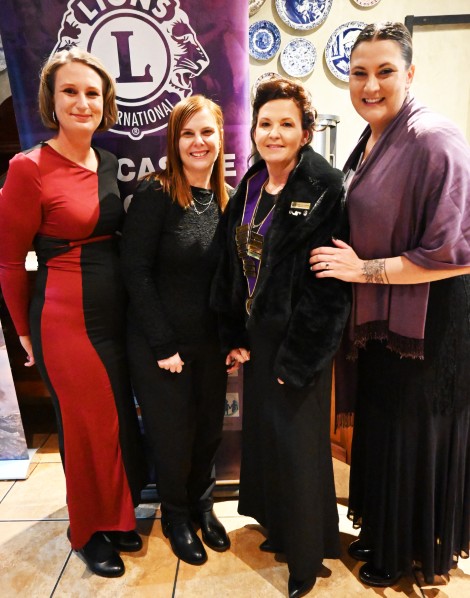 Four Lions Club members are photographed during their Induction Dinner in Newcastle.