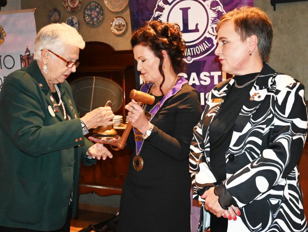Three Lions Club members are photographed during their induction dinner in Newcastle.