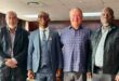 KZN Finance MEC Francois Rodgers with Endumeni Councillors, Salem Abdool, Mayor Mcebo Mkhize and Zitha Shelembe standing shoulder to shoulder.