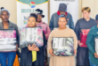 Image of people in Dannhauser receiving a donation of winter blankets.