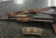 Image of a confiscated AK47 rifle and a magazine.