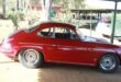Image of a vintage red Porsche car at Talana Museum,