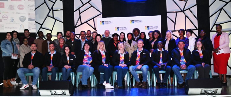 A large group photo of the Newcastle Winter Festival Committee and its beneficiaries.