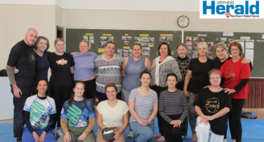 Image of a group of women in a self-defense class.