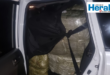 Image of vehicle with bales in the back seat.