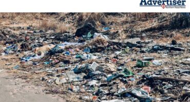 A photograph of illegal dumping in Newcastle. Also spotted in the photo is the carcass of a dead dog.