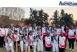 A large group photo taken of female cricket players.