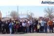 A large group of children and their parents get ready to run.
