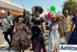 A photograph of a group of people dressed in high fashion, parading through Newcastle CBD.