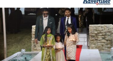 A group of teens and tweens are photograhed walking a red carpet at a fancy matric farewell.