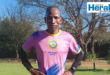 Image of runner with hands on hips.