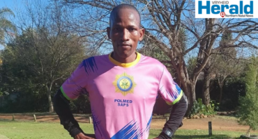 Image of runner with hands on hips.