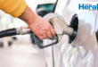 Image of someone filling a car's tank.