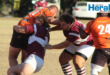 Image of a rugby player tackling another player.