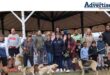 A photo taken of a large group of people with their dogs at St Dominics Newcastle School.