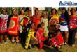 A group photo of school children dressed in traditional Zulu attire.