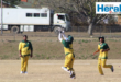 Image of Vryheid High School learners on a cricket pitch.