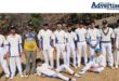 A group photo of a young cricke team.