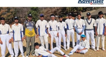 A group photo of a young cricke team.