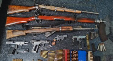 Image of seized firearms and ammunition.